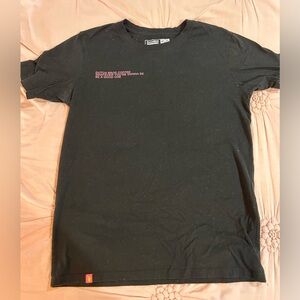 black large tee shirt with pink design.